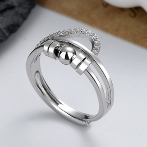 Polished silver spinning ring with zircon micro-paving and rotatable decompression bead