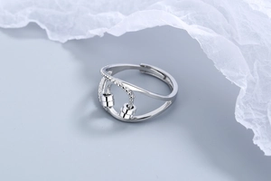 Detail of adjustable silver fidget ring with sliding beads and sparkling zircon stones