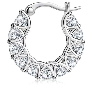 Detail of silver U-shaped hoop earring with triangle-cut zircons in a prong setting