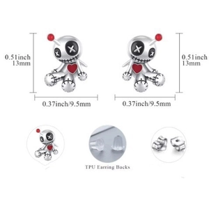 Macro detail of gothic voodoo doll earrings with size specs and earring backs