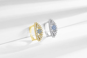 Macro detail of adjustable evil eye rings with blue stones and pave micro zircons