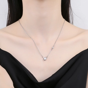 Elegant silver planet necklace with crystal pendant shown on model for a minimalist look
