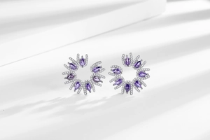 Macro shot of purple gemstone flower stud earrings with sparkling pavé micro diamonds