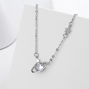 Elegant silver planet pendant necklace with zircon stone and star detail on white base