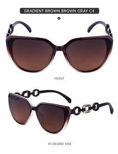 Detail of gradient brown cat-eye sunglasses with gold and black chain link temple decor