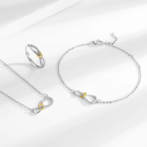 Elegant infinity heart jewelry set with necklace bracelet and ring in silver and gold