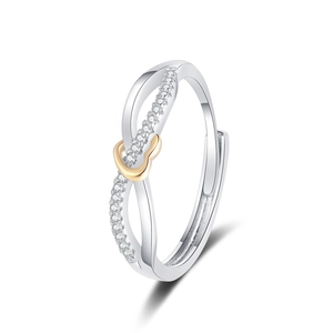 Silver infinity heart ring with gold accent and pavé crystals in a 45-degree angle view