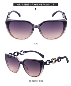 Detail view of cat eye sunglasses with chain link temples and gradient lenses