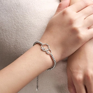 Detail of S925 silver beaded bracelet showing interlocking rings and round zircon