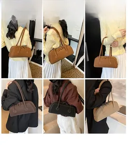 Detailed view of the vintage faux leather bowling bag worn by models in four colors