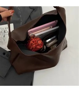 Interior view of brown PU leather tote bag showing large capacity for tablet and umbrella