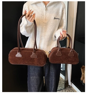 Brown suede Boston bags in large and small sizes with vintage cylinder design