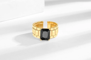 Detailed close-up of retro gold adjustable ring with large rectangular black zircon stone