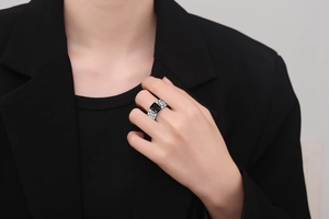 Detail of vintage style rectangular black zircon ring with a unique link band design