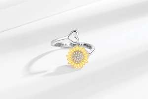 Detail of engraved 'You are my sunshine' message and sunflower zircon on silver ring