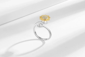 Detail showing sunflower ring with engraved sunshine Going text and sparkling zircon stones
