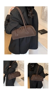 Detail of chocolate brown baguette bag with white contrast stitching and double zipper closure