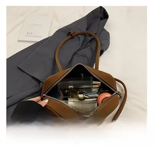 Internal view of the brown tote bag showing its spacious capacity for daily cosmetics