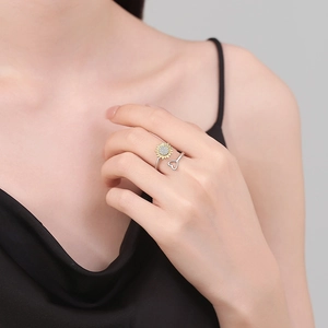 Minimalist spinning sunflower ring with heart design and white cubic zirconia accents