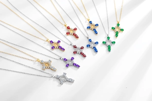 Detail of colorful cross pendants with micro-set zircon and Virgin Mary relief