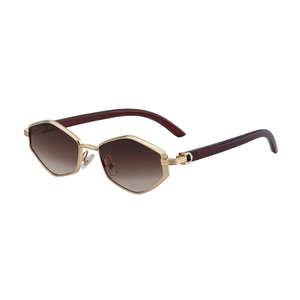 Polygonal gold metal sunglasses for women featuring gradient brown lenses and C-shaped hinge