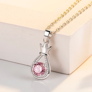 Elegant silver crown necklace with pink zircon drop pendant for women on a white background