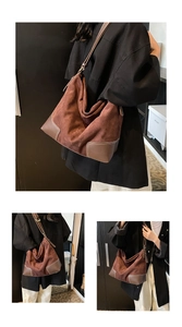 Dettagli macro in pelle scamosciata marrone scuro e cuciture sulla grande borsa hobo vintage