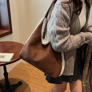 Brown faux suede tote bag with white faux fur trim and shoulder strap for autumn