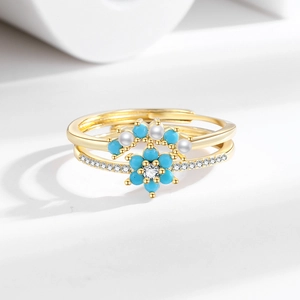 Elegant gold plated flower ring set with blue petals, clear zircon and tiny pearls