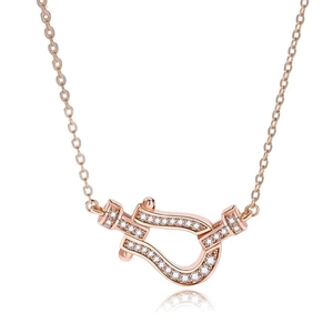 Rose gold horseshoe necklace with micro-paved zircons and a delicate chain on white background