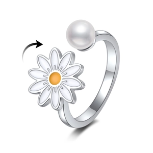 Close-up of rotatable daisy flower and white pearl on minimalist silver open ring