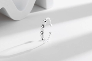 Close-up of S925 silver fidget ring with adjustable band and matte finish beads