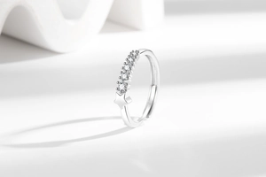 Macro view of polished star ring detail featuring micro-set cubic zirconia stones