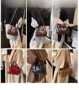 Detail view of vintage PU leather bowling bag with twin bows and adjustable strap