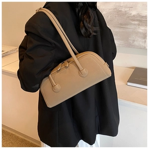 Detail shot of khaki rectangular tote bag with long shoulder straps and fine stitching