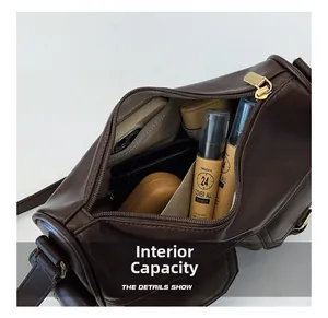 Interior view of brown leather tote bag showing large capacity and inner pocket