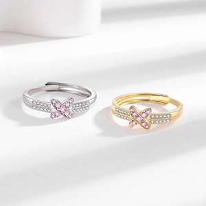 Pink zircon X-cross open rings in gold and silver finish with pavé set accents