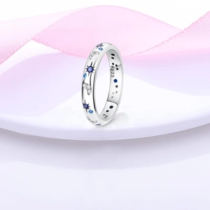 Macro detail of S925 sterling silver stamp and blue cubic zirconia starry moon ring