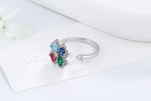Close-up of four-leaf clover adjustable ring with multicolor zircon and silver finish