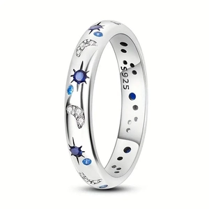 Macro shot of S925 sterling silver ring with starry moon relief and blue zircon inlay