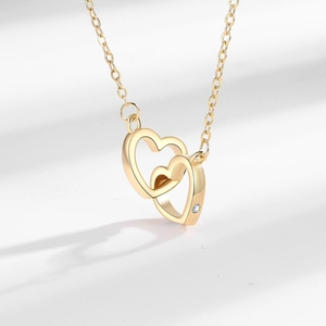Elegant gold double interlocking heart necklace with a sparkling zircon accent pendant