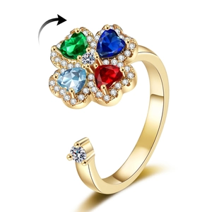 Rotating four-leaf clover ring with colorful crystals and adjustable gold band