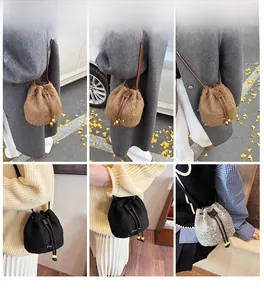 Detail of wool bucket bags with drawstring closure and slim leather straps in three colors