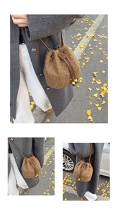 Close-up of brown plush bucket bag with leather drawstring and decorative yellow beads