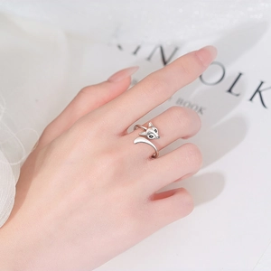 Polished silver adjustable fox open ring with black gem eyes worn on hand