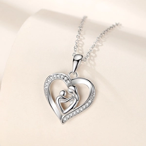 Silver heart necklace with mother and child silhouette and sparkling zircons on O-chain