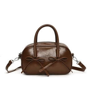 Retro brown bowling bag with twin bows and detachable strap in vintage leather look