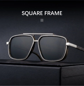 Detail of square polarized sunglasses with silver metal double bridge and dark lenses