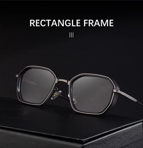 Macro detail of gunmetal sunglasses frame with industrial grid side shields on display box