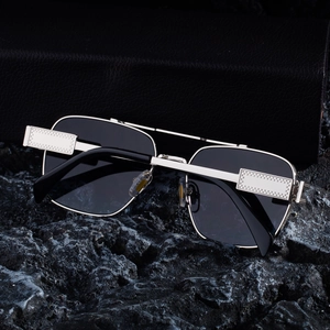 Detailed macro of silver square frame sunglasses with textured metal temple details